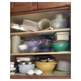 Tupperware and food storage containers in cabinet
