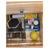 Contents of drawer. Coasters, spice rack and more