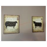 Pair of cow and sheep prints above pub table in