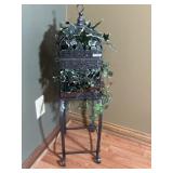 Metal bird cage with greenery and stand