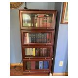 60x29 glass front 4 shelf bookshelf, contents not