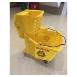 Yellow mop bucket