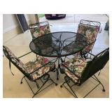 Green rod iron patio table and 4 chairs