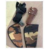 2 gun holsters and 2 guns cases