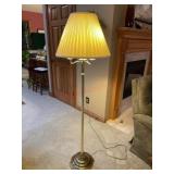 60" tall brass colored lamp and shade working