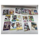 Lot of football and baseball trading cards.