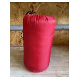 Red sleeping bag with carrier may be child