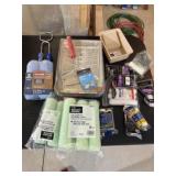 Lot of paint rollers and paint trays