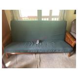 Futon with green mattress