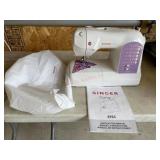 Singer curvy sewing machine with manual and cover