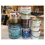 7 cans of paint partially used
