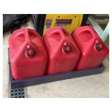 Three 5 gallon gas cans