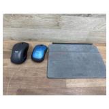 2 wireless mouse and partial apple iPad stand
