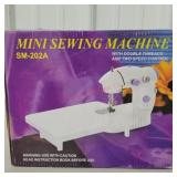 Mini sewing machine, used