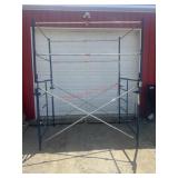 Metaltexh blue scaffolding with platform rails.