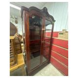 Cherry lighted glass front curio cabinet with