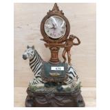 ZEBRA LAMP ON WOOD BASE W/ CLOCK AND MONKEY ON