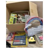 Box with tape measure. washer hoses and misc.