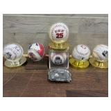 6 x baseballs and 1 belt buckle