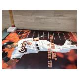 About 14 assorted posters including baseball,