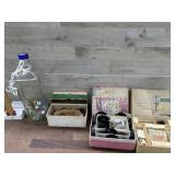 Bottle of marbles, sewing machine parts