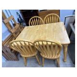 Oak finish dining table with 4 arrow back chairs