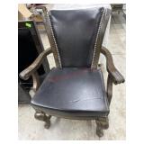 Brown leather arm chair with nail head trim
