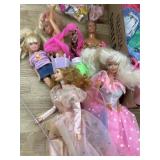 Flat of Barbie and Ken dolls and barbie clthing