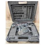 Black plastic tool case with sockets and wrenches