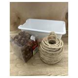 Crafting pine cones, twine and white storage