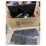 Box with keyboards and computer monitor and