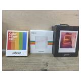 Polaroid camera with film and album