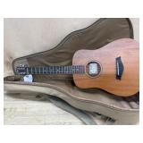 Baby Taylor 5 string guitar.