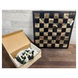 Chess board and box of chess pieces
