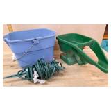 Blue bucket and lawn seeder