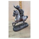 Metal horse and rider statue
