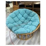 Papasan chair with green cushion