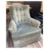 Upholstered green rocking chair