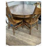 Round oak pedestal table with 2 press back chairs