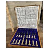 Chess board with chess pieces inside