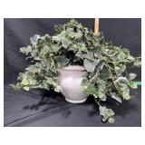 White urn with artificial greenery