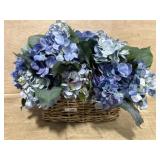 Wicker basket of blue silk flowers