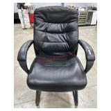 Black faux leather office guest chair with sled