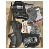 Flat of holsters and grips varying brands and