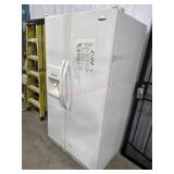 White Whirlpool side by side refrigerator