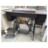 Singer treadle sewing machine in cabinet