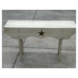 White wood bench with star design