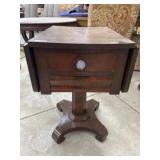 Antique Empire style pedestal drop leaf table