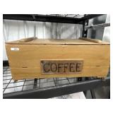 Old wood crate with coffee on front