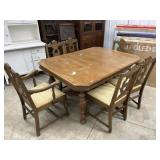 Antique carved apron dining table with 6 chairs
